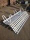 Large painted metal bench with wooden slats 